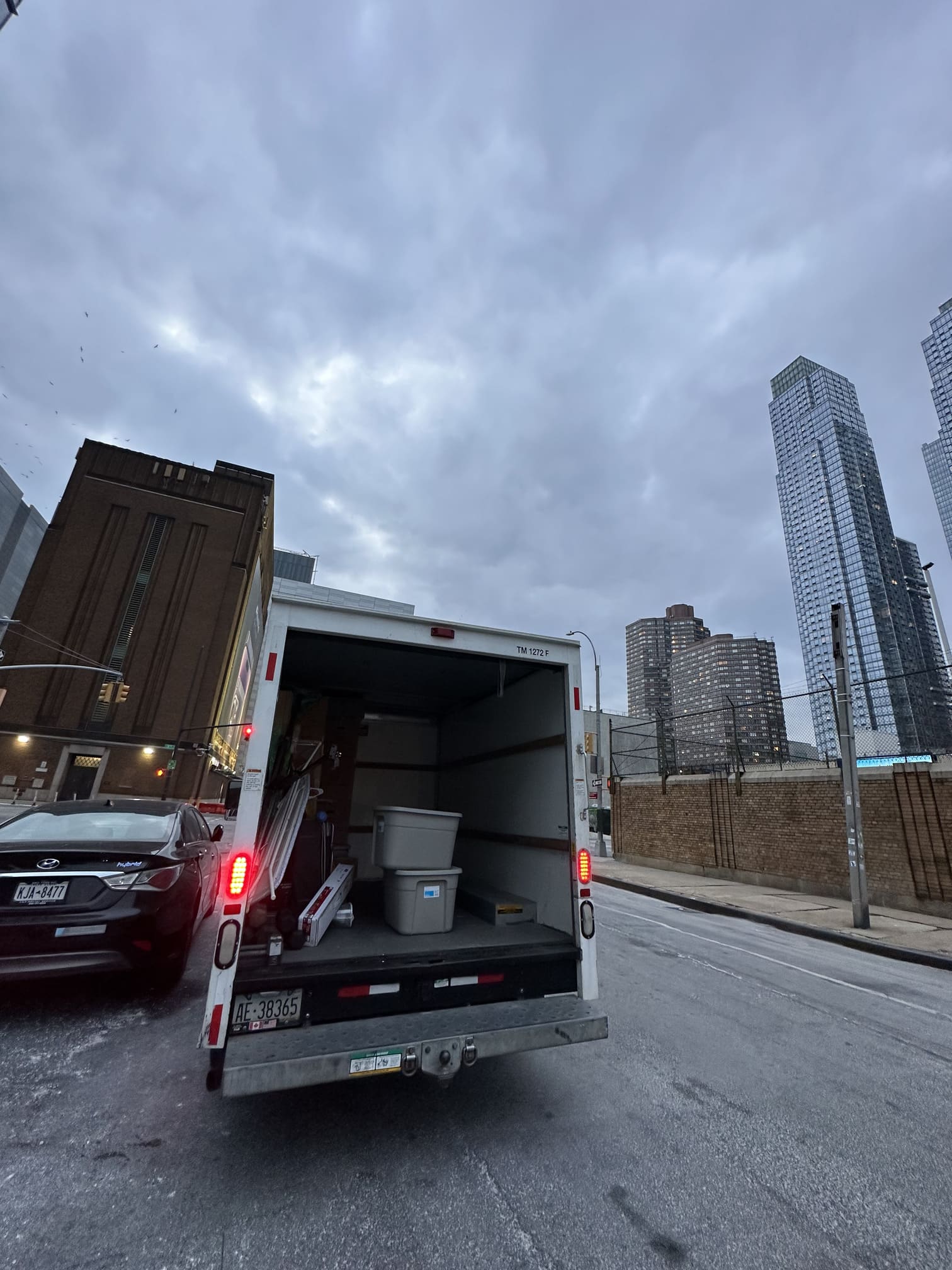 Team of movers carrying a sofa
